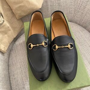 Women’s black Gucci loafers